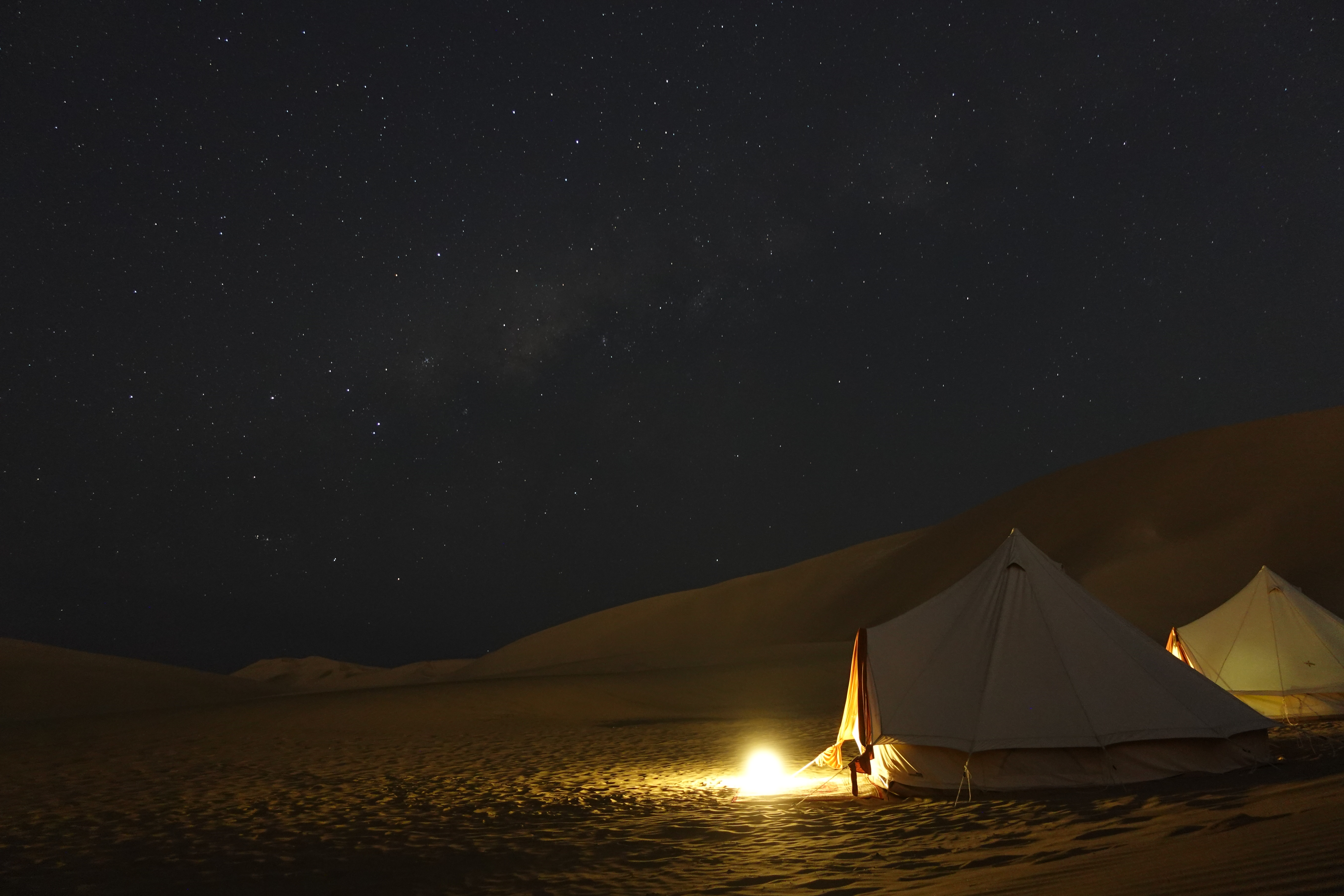 An image of the desert near Huacachina Oasis at night in Peru